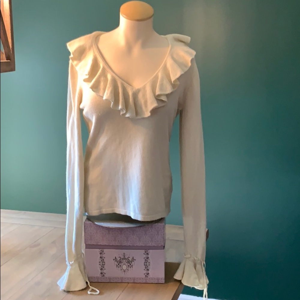 Cream sweater with ruffle collar and sleeves
